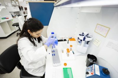 staff member preparing samples for residual pesticide testing